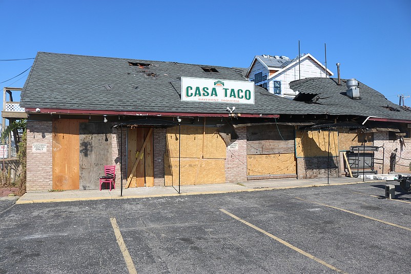 The intense fire caused part of the roof to collapse to the right of the Casa Taco sign.