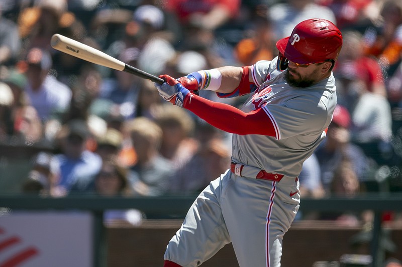 May 29, 2024; San Francisco, California, USA; Philadelphia Phillies designated hitter Kyle Schwarber (12) follows through on his RBI single against the San Francisco Giants during the eighth inning at Oracle Park. Mandatory Credit: D. Ross Cameron-USA TODAY Sports