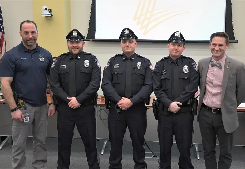 New Lansdale police officers Richard Schenk, John Ruel and James Gray with police Lieutenant Ryan Devlin, far left, and Mayor Garry Herbert, far right, after receiving their oaths and badges on March 15, 2023. (Photo courtesy of Lansdale PD)