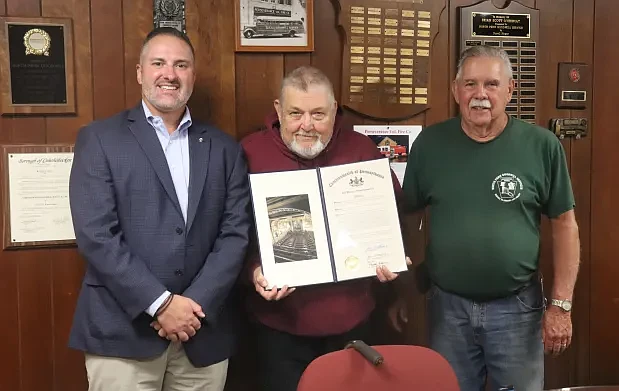 Goodwill President Jim Thomas displays the proclamation alongside Goodwill Chief Jim Hange and State Rep. Steve Malagari. (John Worthington – MediaNews Group)