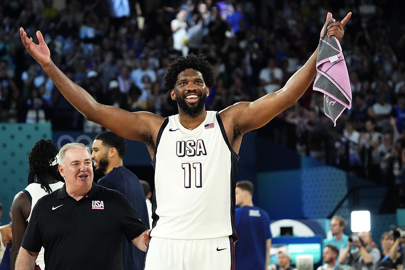 Aug 8, 2024; Paris, France; United States centre Joel Embiid (11) celebrates after the game against Serbia in a men's basketball semifinal game during the Paris 2024 Olympic Summer Games at Accor Arena. Mandatory Credit: Rob Schumacher-USA TODAY Sports