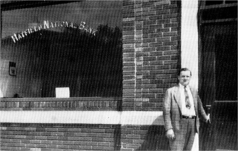 Nelson S. Hartranft, standing in front, of the former firehouse in Hatfield Borough when it was a bank. Credit: Hatfield Museum & History Society.