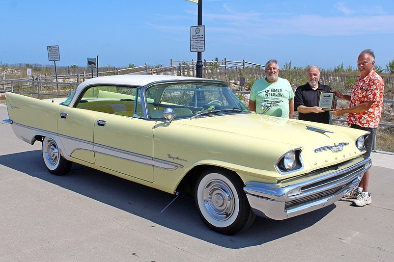 Auto Show host Jim Ambro and Sea Isle City Mayor Leonard Desiderio present the Mayor's Choice Award to Perry Rogers, of Collegeville, Pa., for his 1957 DeSoto Fire Dome Sportsman. (Photos courtesy of Sea Isle City)