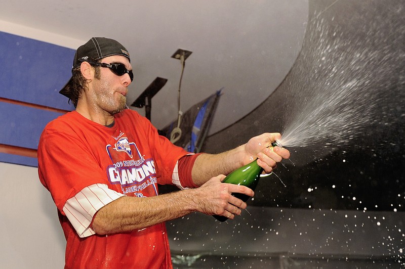 Oct 21, 2009; Philadelphia, PA, USA; Philadelphia Phillies right fielder Jayson Werth (28) spays champagne in the locker room after defeating the Los Angeles Dodgers during game five of the NLCS at Citizens Bank Park. The Phillies defeated the Dodgers 10-4. Mandatory Credit: Howard Smith-USA TODAY Sports