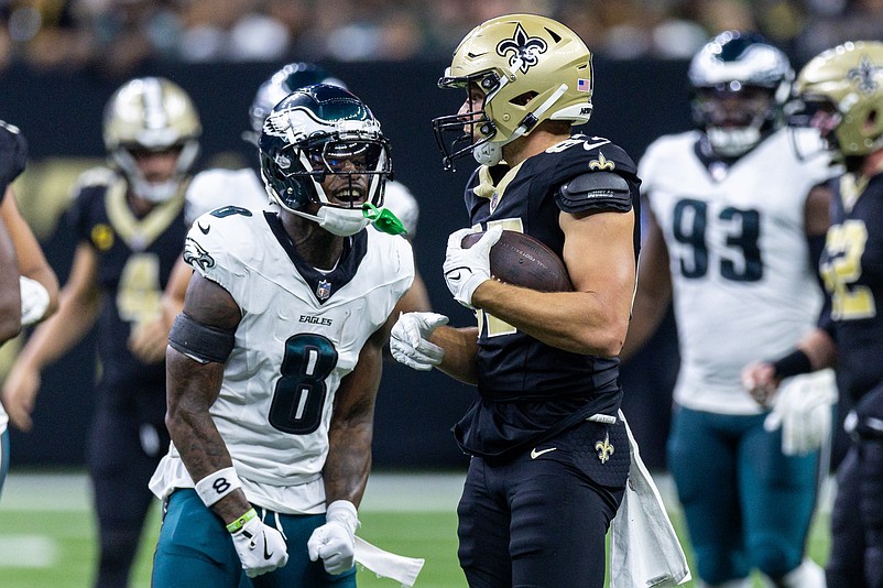 Sep 22, 2024; New Orleans, Louisiana, USA; Philadelphia Eagles safety C.J. Gardner-Johnson (8) yells at New Orleans Saints tight end Foster Moreau (87) during the first half at Caesars Superdome. Mandatory Credit: Stephen Lew-Imagn Images