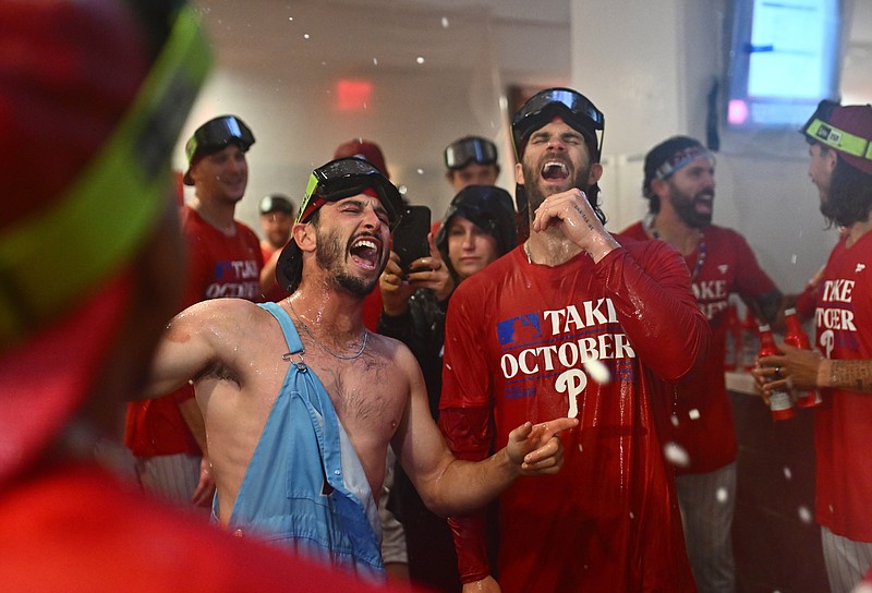 Sep 26, 2023; Philadelphia, Pennsylvania, USA; Philadelphia Phillies catcher Garrett Stubbs (21) celebrates with first baseman Bryce Harper (3) after the game against the Pittsburgh Pirates at Citizens Bank Park. Mandatory Credit: Kyle Ross-USA TODAY Sports