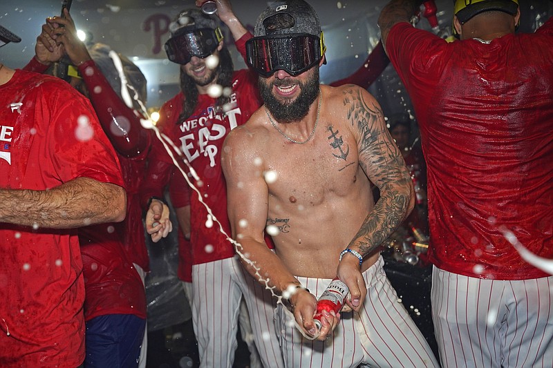 Sep 23, 2024; Philadelphia, Pennsylvania, USA; Philadelphia Phillies outfielder Cal Stevenson (47)  celebrate the National League East Division title in the locker room after defeating the Chicago Cubs at Citizens Bank Park. Mandatory Credit: Eric Hartline-Imagn Images