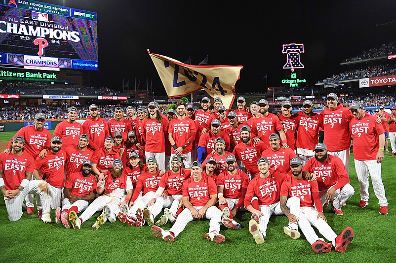 Sep 23, 2024; Philadelphia, Pennsylvania, USA; Philadelphia Phillies celebrate winning the National League East Division Champs with a win against the Chicago Cubs at Citizens Bank Park. Mandatory Credit: Eric Hartline-Imagn Images