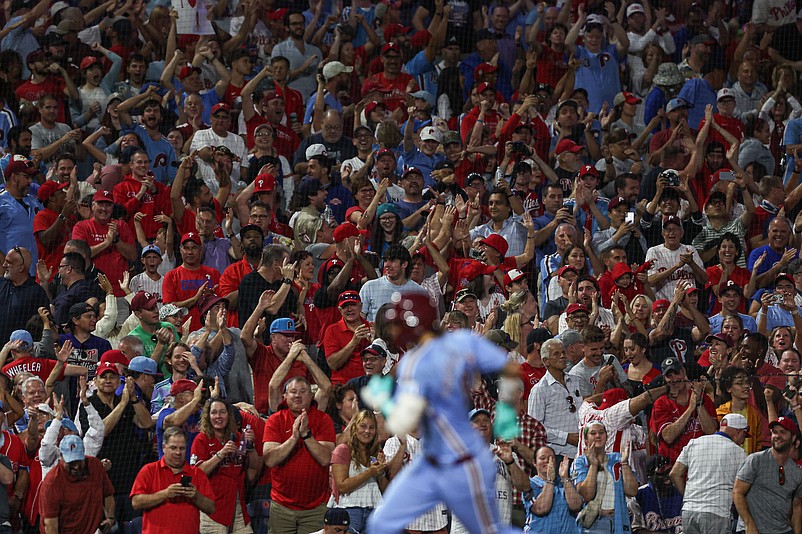 Aug 29, 2024; Philadelphia, Pennsylvania, USA; Fans cheer behind Philadelphia Phillies outfielder Nick Castellanos (8) as he runs the bases after hitting a two RBI home run against the Atlanta Braves during the seventh inning at Citizens Bank Park. Mandatory Credit: Bill Streicher-USA TODAY Sports