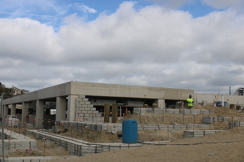 The building's massive concrete structure takes shape.