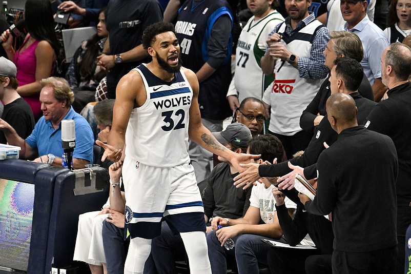 May 28, 2024; Dallas, Texas, USA; Minnesota Timberwolves center Karl-Anthony Towns (32) fouls out against the Dallas Mavericks during the second half in game four of the western conference finals for the 2024 NBA playoffs at American Airlines Center. Mandatory Credit: Jerome Miron-USA TODAY Sports