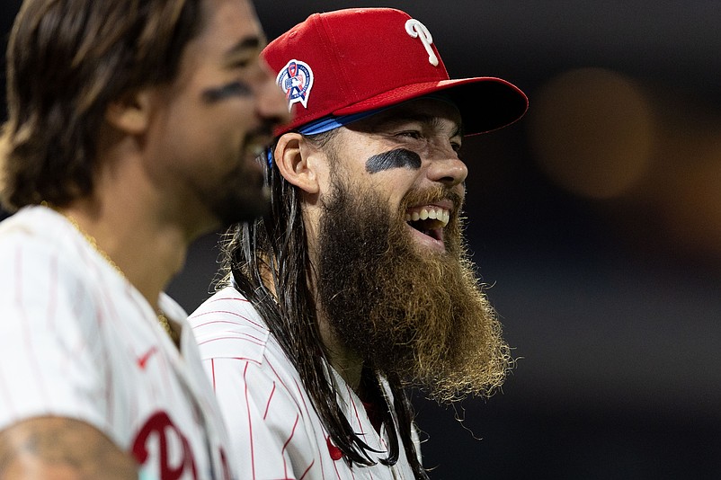 Sep 11, 2024; Philadelphia, Pennsylvania, USA; Philadelphia Phillies outfielder Brandon Marsh (R) shares a laugh with outfielder Nick Castellanos (L) before the eighth inning against the Tampa Bay Rays at Citizens Bank Park. Mandatory Credit: Bill Streicher-Imagn Images