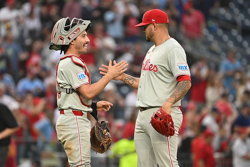 Sep 29, 2024; Washington, District of Columbia, USA; Philadelphia Phillies relief pitcher Jose Ruiz (66) and catcher Garrett Stubbs (21) celebrate after defeating the Washington Nationals at Nationals Park. Mandatory Credit: Rafael Suanes-Imagn Images