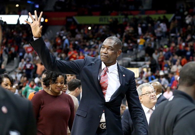 Nov 24, 2015; Atlanta, GA, USA; Atlanta Hawks former center Dikembe Mutumbo reacts to the crowd after his jersey is retired at half time of the Boston Celtics vs Atlanta Hawks game at Philips Arena. Mandatory Credit: Jason Getz-USA TODAY Sports