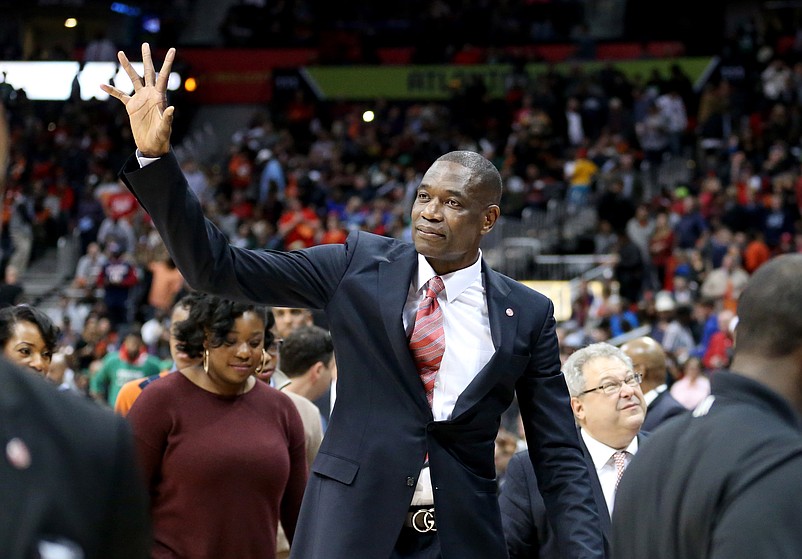 Nov 24, 2015; Atlanta, GA, USA; Atlanta Hawks former center Dikembe Mutumbo reacts to the crowd after his jersey is retired at half time of the Boston Celtics vs Atlanta Hawks game at Philips Arena. Mandatory Credit: Jason Getz-USA TODAY Sports