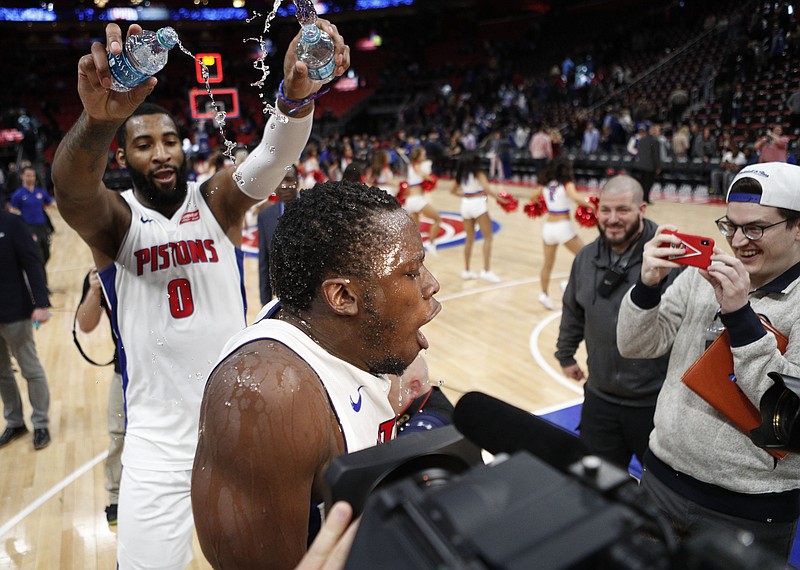 Apr 6, 2018; Detroit, MI, USA; Detroit Pistons center Andre Drummond (0) pours water on guard Reggie Jackson (1) after the game against the Dallas Mavericks at Little Caesars Arena. Mandatory Credit: Raj Mehta-USA TODAY Sports