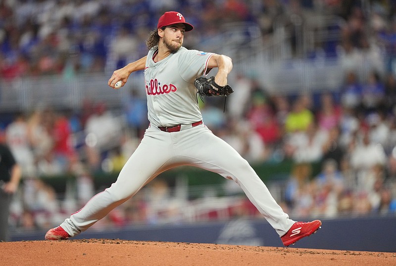 Sep 7, 2024; Miami, Florida, USA;  Philadelphia Phillies pitcher Aaron Nola (27) pitches in the first inning against the Miami Marlins at loanDepot Park. Mandatory Credit: Jim Rassol-Imagn Images