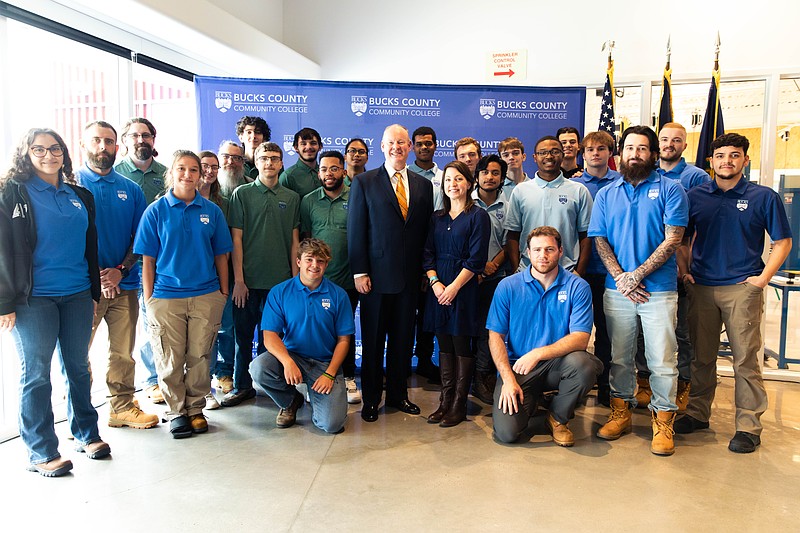 BCCC President & CEO Dr. Patrick M. Jones and Director of Workforce Development Initiatives for PA Department of Community & Economic Development Gwen Ross pictured with BCCC manufacturing and trades students. (Credit: BCCC)