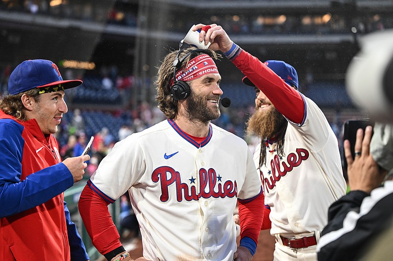 Sep 23, 2023; Philadelphia, Pennsylvania, USA;  Philadelphia Phillies center fielder Brandon Marsh and  second baseman Bryson Stott harass designated hitter Bryce Harper during a post game interview after the game against the New York Mets at Citizens Bank Park. Philadelphia won 7-5. Mandatory Credit: John Geliebter-USA TODAY Sports