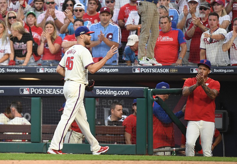 Oct 5, 2024; Philadelphia, PA, USA; Fans cheer as Philadelphia Phillies pitcher Zack Wheeler (45) heads to the dugout in the seventh inning against the New York Mets in game one of the NLDS for the 2024 MLB Playoffs at Citizens Bank Park. Mandatory Credit: Eric Hartline-Imagn Images