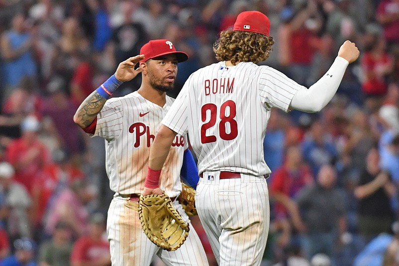 Aug 21, 2023; Philadelphia, Pennsylvania, USA; Philadelphia Phillies third baseman Edmundo Sosa (33) and Philadelphia Phillies first baseman Alec Bohm (28) celebrate win against the San Francisco Giants at Citizens Bank Park. Mandatory Credit: Eric Hartline-USA TODAY Sports