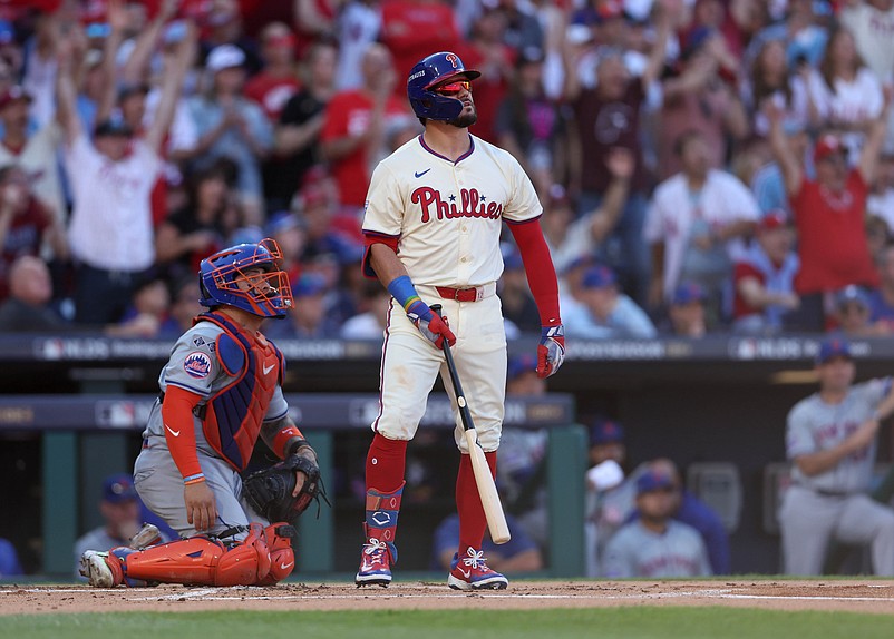 Oct 5, 2024; Philadelphia, PA, USA; Philadelphia Phillies designated hitter Kyle Schwarber (12) hits a solo home run against the New York Mets in the first inning in game one of the NLDS for the 2024 MLB Playoffs at Citizens Bank Park. Mandatory Credit: Bill Streicher-Imagn Images