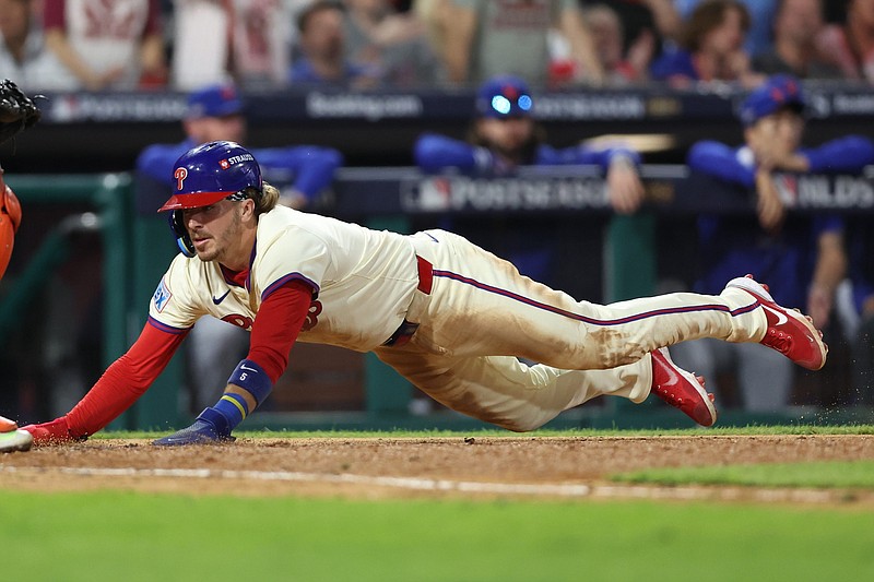 Oct 6, 2024; Philadelphia, Pennsylvania, USA; Philadelphia Phillies second base Bryson Stott (5) scores a tun in the eighth inning against the New York Mets during game two of the NLDS for the 2024 MLB Playoffs at Citizens Bank Park. Mandatory Credit: Bill Streicher-Imagn Images