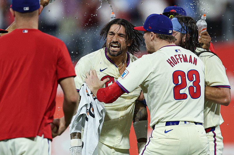 Oct 6, 2024; Philadelphia, Pennsylvania, USA; Philadelphia Phillies outfielder Nick Castellanos (8) celebrates with teammates after hitting a walk off game winning RBI single during the ninth inning against the New York Mets in game two of the NLDS for the 2024 MLB Playoffs at Citizens Bank Park. Mandatory Credit: Bill Streicher-Imagn Images