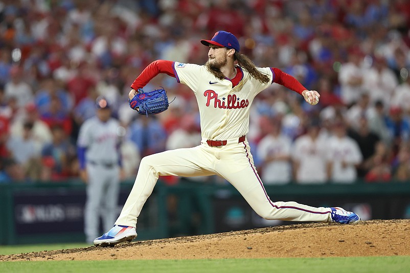 Oct 6, 2024; Philadelphia, Pennsylvania, USA; Philadelphia Phillies relief pitcher Matt Strahm (25) pitches in the ninth inning against the New York Mets  during game two of the NLDS for the 2024 MLB Playoffs at Citizens Bank Park. Mandatory Credit: Bill Streicher-Imagn Images