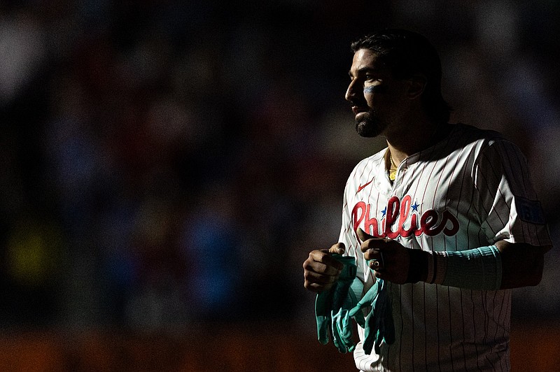 Sep 11, 2024; Philadelphia, Pennsylvania, USA; Philadelphia Phillies outfielder Nick Castellanos (8) looks on during a light display during the ninth inning against the Tampa Bay Rays at Citizens Bank Park. Mandatory Credit: Bill Streicher-Imagn Images