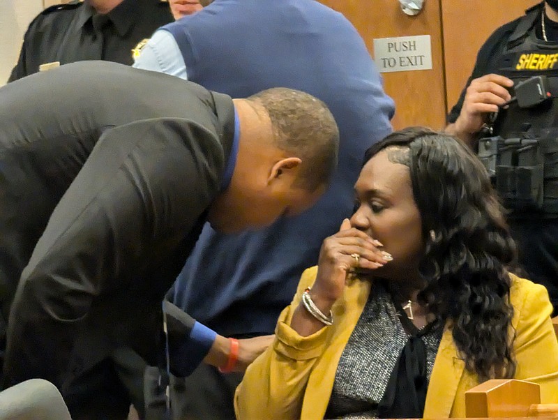 Marty and La'Quetta Small talk before their arraignment.