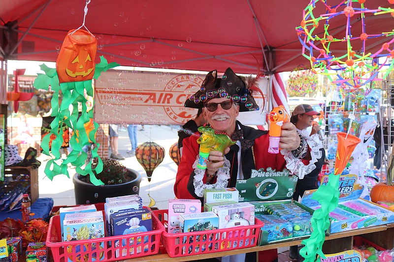Dressed in a pirate outfit, Air Circus owner Doug Jewell entertains the crowds at the 2024 Fall Block Party.