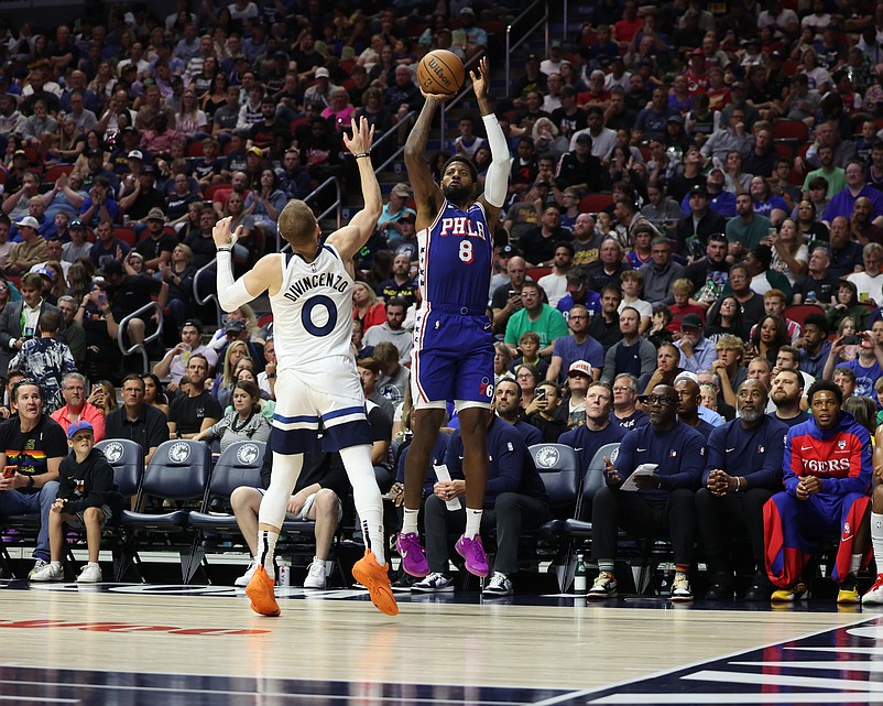 Oct 11, 2024; Des Moines, Iowa, USA; Philadelphia 76ers forward Paul George (8) shoots over Minnesota Timberwolves guard Donte DiVincenzo (0) at Wells Fargo Arena. Mandatory Credit: Reese Strickland-Imagn Images