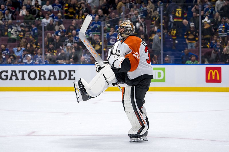 Oct 11, 2024; Vancouver, British Columbia, CAN; Philadelphia Flyers goalie Samuel Ersson (33) celebrates the victory against the Vancouver Canucks at Rogers Arena. Mandatory Credit: Bob Frid-Imagn Images