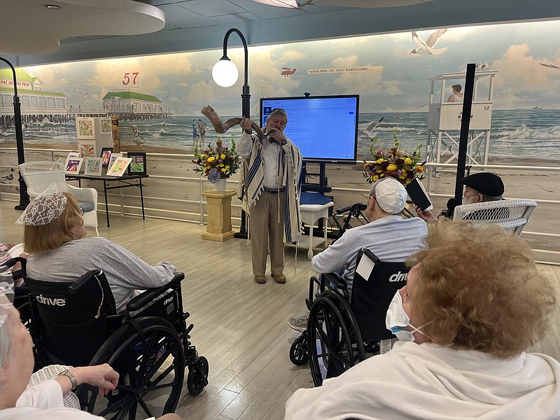 Dr. Robert Goldberg sounds the shofar during a service at Seashore Gardens in Galloway Township.