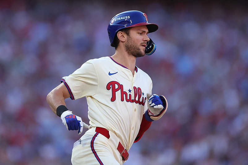 Oct 6, 2024; Philadelphia, Pennsylvania, USA; Philadelphia Phillies shortstop Trea Turner (7) advances to first base in the first inning against the New York Mets during game two of the NLDS for the 2024 MLB Playoffs at Citizens Bank Park. Mandatory Credit: Bill Streicher-Imagn Images