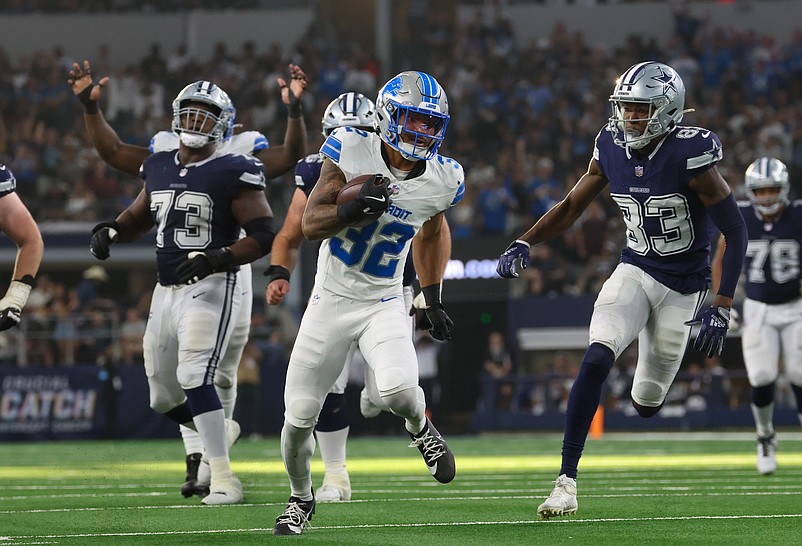 Oct 13, 2024; Arlington, Texas, USA; Detroit Lions safety Brian Branch (32) returns an interception during the second half against the Dallas Cowboys  at AT&T Stadium. Mandatory Credit: Kevin Jairaj-Imagn Images