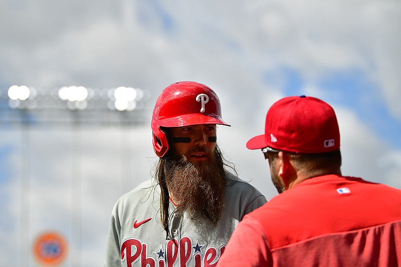 May 3, 2023; Los Angeles, California, USA; Philadelphia Phillies center fielder Brandon Marsh (16) speaks with hitting coach Kevin Long (53) before hitting against the Los Angeles Dodgers. during the eighth inning at Dodger Stadium. Mandatory Credit: Gary A. Vasquez-USA TODAY Sports