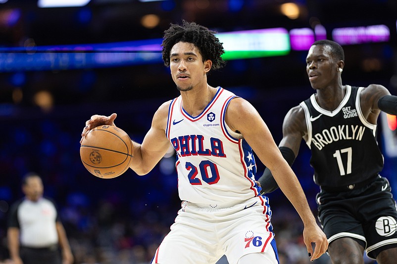 Oct 16, 2024; Philadelphia, Pennsylvania, USA; Philadelphia 76ers guard Jared McCain (20) dribbles the ball in front of Brooklyn Nets guard Dennis Schroder (17) during the fourth quarter at Wells Fargo Center. Mandatory Credit: Bill Streicher-Imagn Images