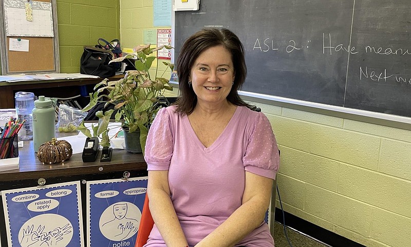 Signing her classes away: Mrs. SallyAnn Emilius teaches American Sign Language at NPHS, and as a deaf person herself, she has embraced her role in the worlds of both the hearing and the deaf.  (Credit: Silas Winship)