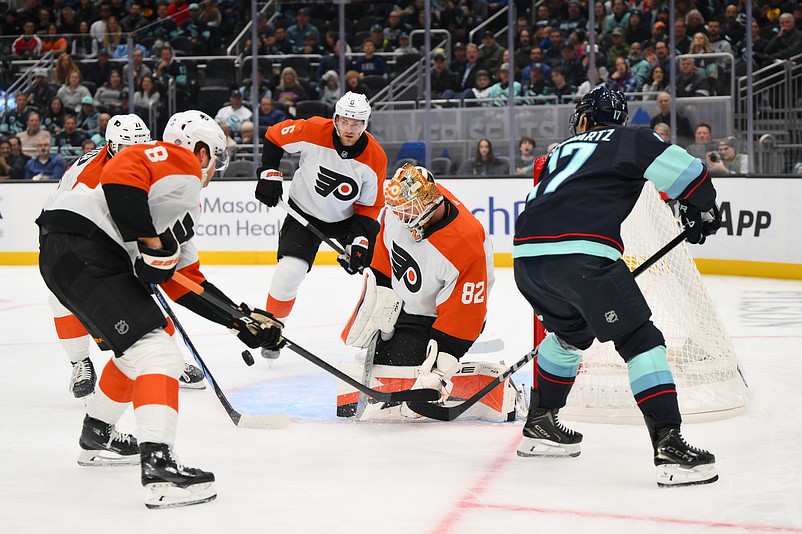 Oct 17, 2024; Seattle, Washington, USA; Philadelphia Flyers goaltender Ivan Fedotov (82) blocks a goal shot against the Seattle Kraken during the first period at Climate Pledge Arena. Mandatory Credit: Steven Bisig-Imagn Images