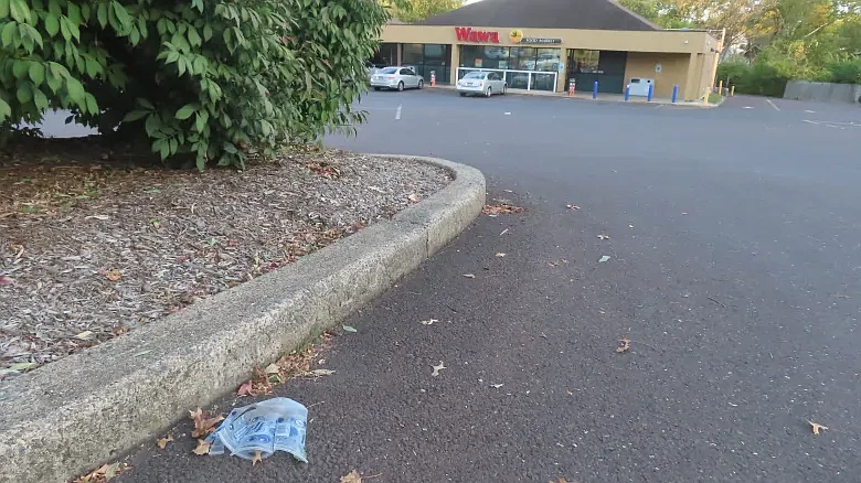 A plastic cup sits in the driveway to the Wawa at Sumneytown Pike and Valley Forge Road in Upper Gwynedd on Tuesday, Oct. 8, 2024.