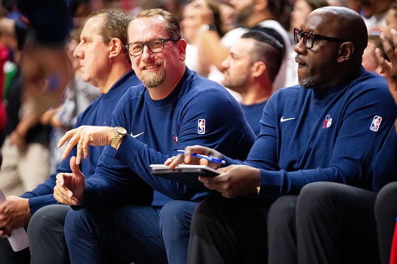 Philadelphia head coach Nick Nurse smiles from the bench on Friday, Oct. 11, 2024, at Wells Fargo Arena in Des Moines.