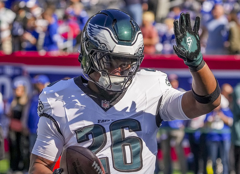 Oct 20, 2024; East Rutherford, New Jersey, USA;  Philadelphia Eagles running back (and former NY Giants back) Saquon Barkley (26) greets fans at MetLife Stadium. Mandatory Credit: Robert Deutsch-Imagn Images