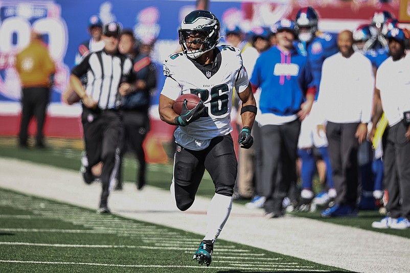 Oct 20, 2024; East Rutherford, New Jersey, USA; Philadelphia Eagles running back Saquon Barkley (26) carries the ball against the New York Giants during the first half at MetLife Stadium. Mandatory Credit: Vincent Carchietta-Imagn Images