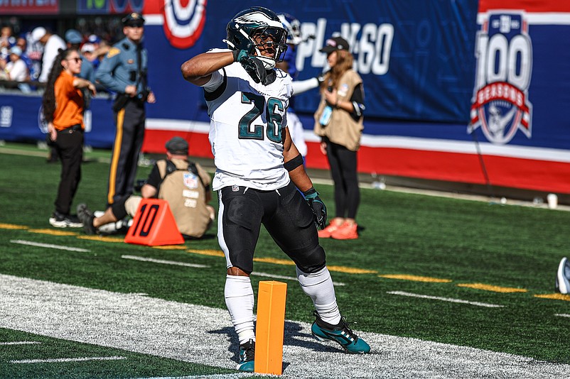 Oct 20, 2024; East Rutherford, New Jersey, USA; Philadelphia Eagles running back Saquon Barkley (26) celebrates after a long run during the first half against the New York Giants at MetLife Stadium. Mandatory Credit: Vincent Carchietta-Imagn Images