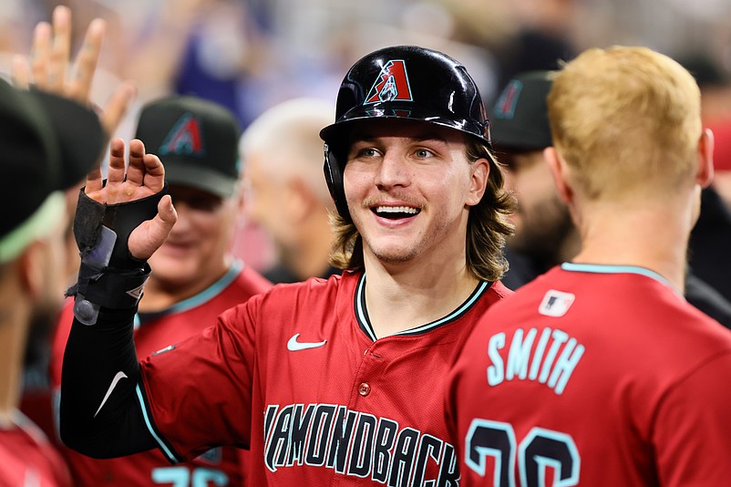 Aug 19, 2024; Miami, Florida, USA; Arizona Diamondbacks center fielder Jake McCarthy (31) celebrates after scoring against the Miami Marlins during the third inning at loanDepot Park. Mandatory Credit: Sam Navarro-USA TODAY Sports