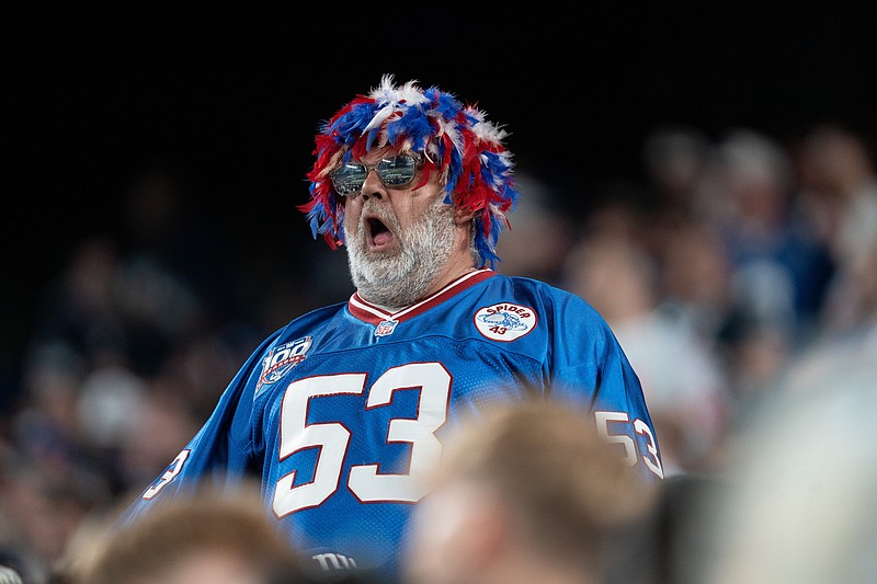 Sep 26, 2024; East Rutherford, NJ, US; A New York Giants fans cheers on his team from the stands at MetLife Stadium. Mandatory Credit: Julian Guadalupe-NorthJersey.com