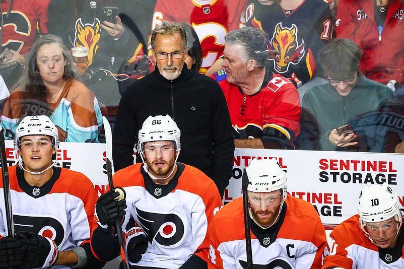 Oct 12, 2024; Calgary, Alberta, CAN; Philadelphia Flyers head coach John Tortorella on his bench against the Calgary Flames during the first period at Scotiabank Saddledome. Mandatory Credit: Sergei Belski-Imagn Images