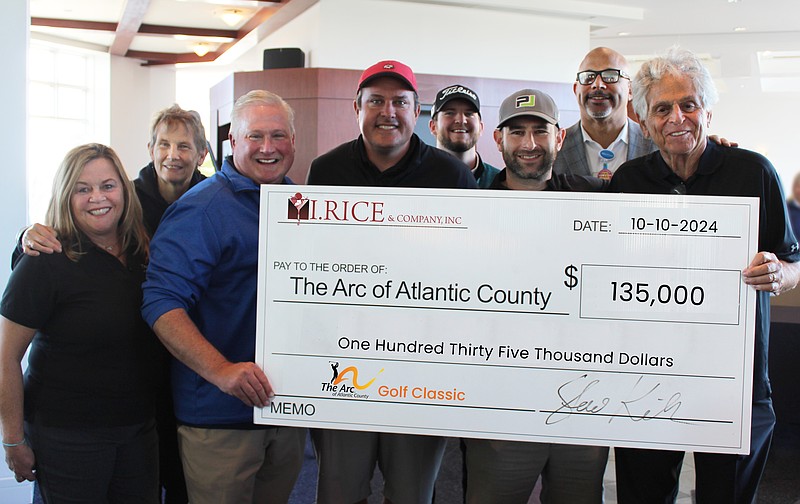 Pictured are (L to R) Mary Ruley Moyer, Director of Development, Pat Jones, COO, Scott Hennis, CEO of The Arc, with Dominic Gallo, Connor Chenard (2nd row) & Ben Honig, CFO and Steve Kuhl, President of I Rice & Company. Joining them (2nd Row) is Darren Clinkscale, Board Chairman of The Arc and Director of Construction at AtlantiCare.